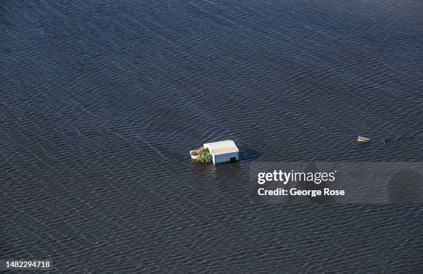 Farm swamped by the re-emergence of Tulare Lake, a once great body of water in the southern Central Valley, now beginning to fill again due to the...