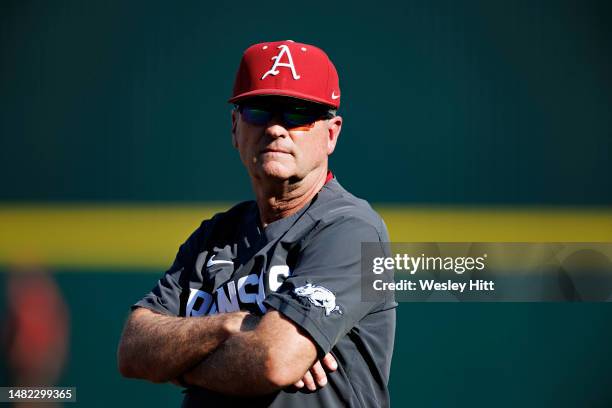 Head Coach Dave Van Horn of the Arkansas Razorbacks watches his team warm up before a game against the Tennessee Volunteers at Baum-Walker Stadium at...