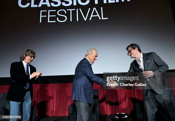 Alexander Payne, George Stevens Jr., and TCM host Ben Mankiewicz speaks onstage during the screening of "Penny Serenade" during the 2023 TCM Classic...