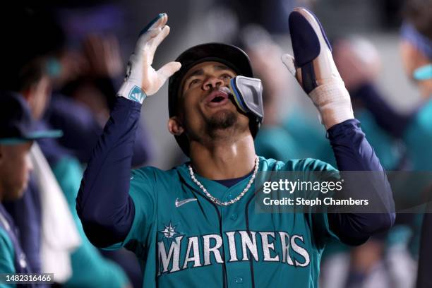 Julio Rodriguez of the Seattle Mariners reacts after scoring a run during the fourth inning against the Colorado Rockies at T-Mobile Park on April...