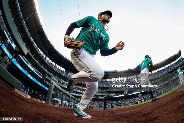 Jarred Kelenic of the Seattle Mariners takes the field before the game against the Colorado Rockies at T-Mobile Park on April 14, 2023 in Seattle,...