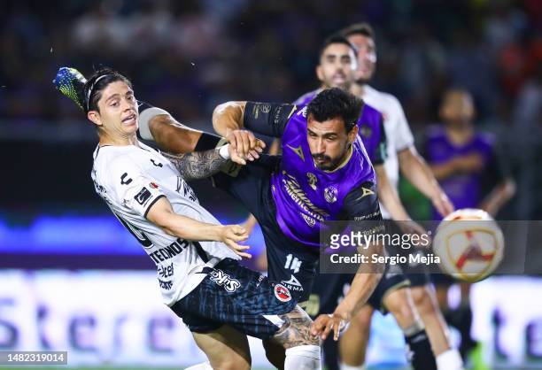 Joaquin Montecinos of Tijuana and Oswaldo Alanis of Mazatlán fight for the ball during the 15th round match between Mazatlan FC and Tijuana as part...