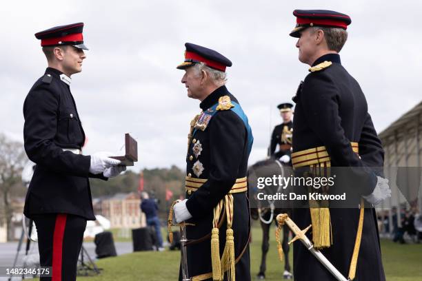 Britain's King Charles III presents an award for best International Cadet to Cadet, B. P. Ritchey from the USA during the 200th Sovereign's parade at...