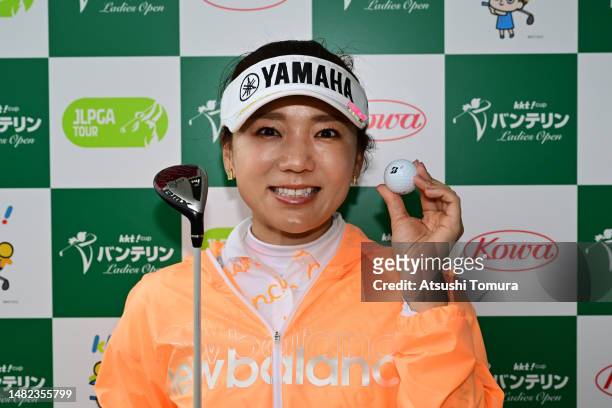 Chie Arimura of Japan poses as she made a hole-in-one on the 8th hole after the second round of KKTcup VANTELIN Ladies Open at Kumamoto Kuko Country...