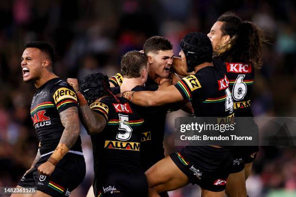 Nathan Cleary of the Panthers celebrates with team mates after kicking the winning field goal in golden point during the round seven NRL match...