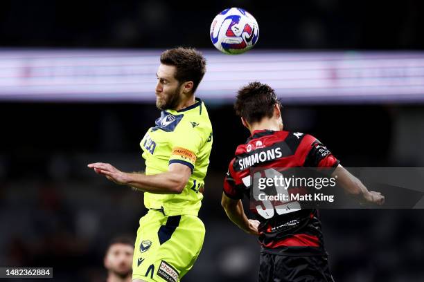 Josh Brilliante of Victory competes for the ball against Aidan Simmons of the Wanderers during the round 24 A-League Men's match between Western...