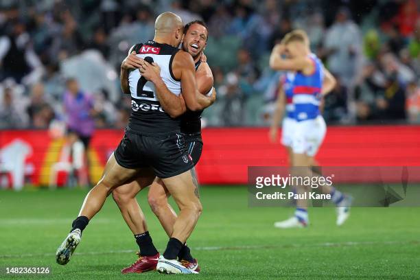 Sam Powell-Pepper and Travis Boak of the Power celebrate a goal during the round five AFL match between Port Adelaide Power and Western Bulldogs at...