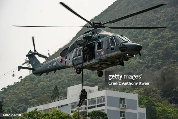 Hong Kong Police stage a counter-terrorism drill during the Hong Kong Police College open day as part of the National Security Education Day...