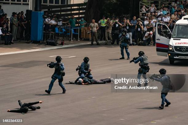 Hong Kong Police stage a counter-terrorism drill during the Hong Kong Police College open day as part of the National Security Education Day...