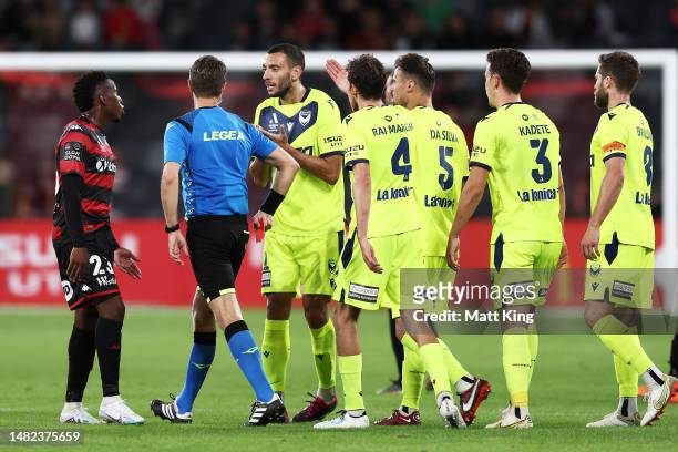 Roderick Miranda of Victory argues with referee Chris Beath after he was given a red card on review during the round 24 A-League Men's match between...