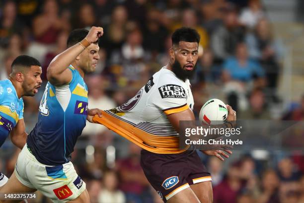 Payne Haas of the Broncos is tackled during the round seven NRL match between Gold Coast Titans and Brisbane Broncos at Cbus Super Stadium on April...