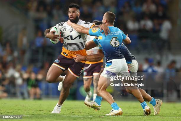 Payne Haas of the Broncos is tackled during the round seven NRL match between Gold Coast Titans and Brisbane Broncos at Cbus Super Stadium on April...