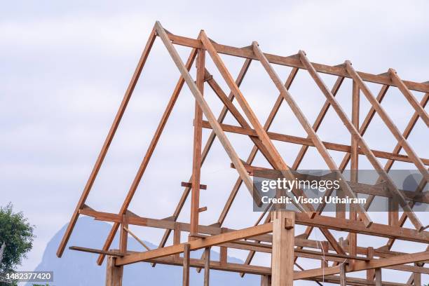roof truss system beams,new home in the process of being built,wood home framing. - roof truss stock pictures, royalty-free photos & images