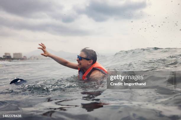 portrait of a teenager overboard - drowning stock pictures, royalty-free photos & images