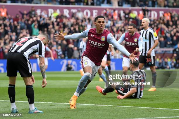 Jacob Ramsey of Aston Villa celebrates after scoring the team's first goal as Kieran Trippier of Newcastle United looks dejected during the Premier...