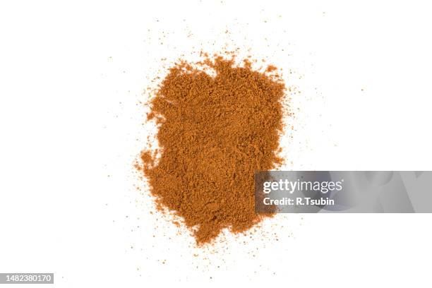 cinnamon powder isolated on a white background - cinnamon stock pictures, royalty-free photos & images