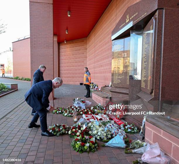 Sir Kenny Dalglish and Andy Hughes laying a wreath at the Hillsborough memorial at Anfield in this handout image provided by Liverpool FC on April...