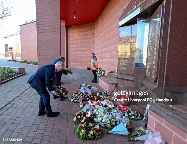 Sir Kenny Dalglish and Andy Hughes laying a wreath at the Hillsborough memorial at Anfield in this handout image provided by Liverpool FC on April...