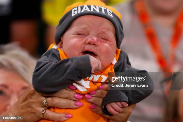 Baby wearing Giants attire cries during the round five Super Netball match between Giants Netball and Collingwood Magpies at Ken Rosewall Arena, on...