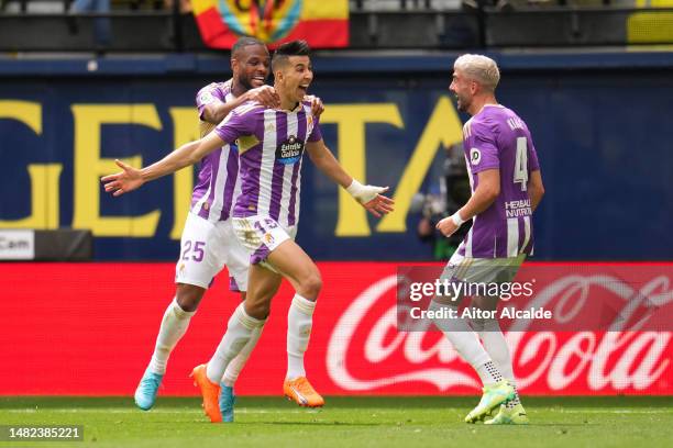 Jawad El Yamiq of Real Valladolid CF celebrates with teammates Cyle Larin and Kike Perez after scoring the team's second goal during the LaLiga...