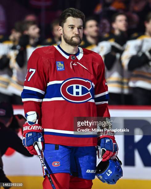 Jonathan Drouin of the Montreal Canadiens stands during the anthems prior to the game against the Boston Bruins at Centre Bell on April 13, 2023 in...