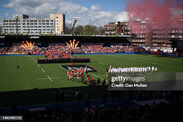 Pyrotechnics go off as Wales players walk out onto the pitch prior to the TikTok Women's Six Nations match between Wales and England at Cardiff Arms...