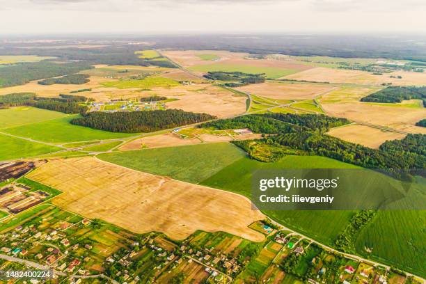 spring field aerial view. drone photography. sustainability. protection of nature. sunset sky background. green forest - carbon cycle stock pictures, royalty-free photos & images