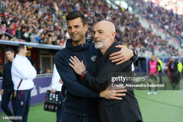 Thiago Motta, Head Coach of Bologna FC and Stefano Pioli, Head Coach of AC Milan, interact prior to the Serie A match between Bologna FC and AC Milan...