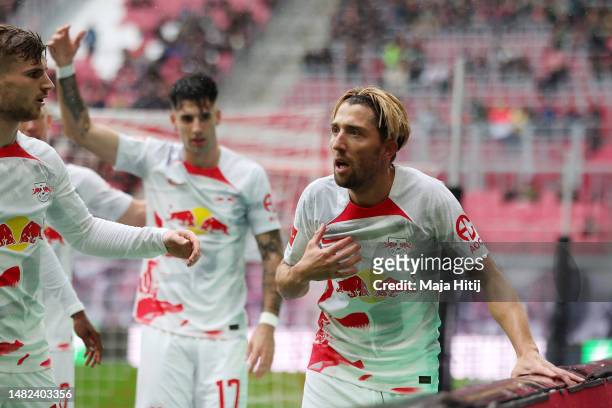 Kevin Kampl of RB Leipzig gestures for medical attention upon scoring the team's first goal during the Bundesliga match between RB Leipzig and FC...