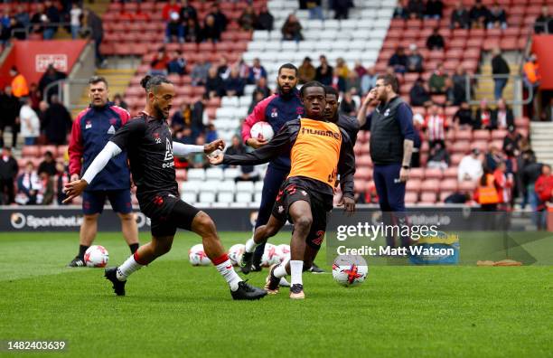 Theo Walcott and Kamaldeen Sulemana of Southampton warm up during the Premier League match between Southampton FC and Crystal Palace at St. Mary's...