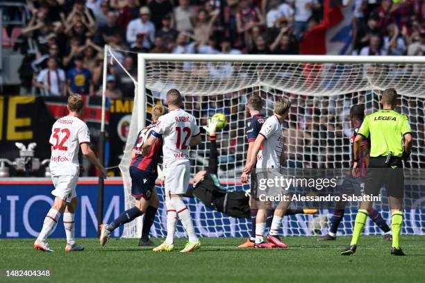 Tommaso Pobega of AC Milan scores the team's first goal past Lukasz Skorupski of Bologna FC during the Serie A match between Bologna FC and AC Milan...