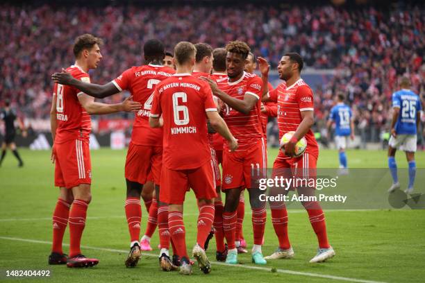 Benjamin Pavard of FC Bayern Munich celebrates with teammates after scoring the team's first goal during the Bundesliga match between FC Bayern...