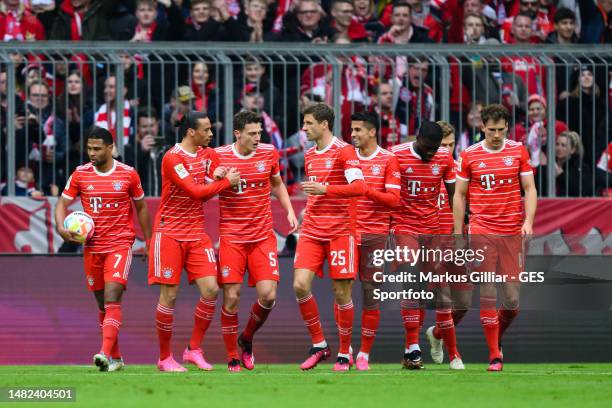 Benjamin Pavard of Bayern celebrates after scoring his team's first goal with his teammates Leroy Sane and Thomas Mueller during the Bundesliga match...