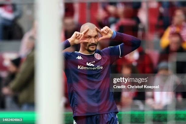 Ludovic Ajorque of 1.FSV Mainz 05 celebrates after scoring the team's first goal during the Bundesliga match between 1. FC Köln and 1. FSV Mainz 05...