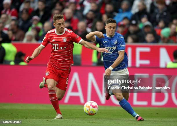 Joshua Kimmich of FC Bayern Muenchen , Christoph Baumgartner of TSG 1899 Hoffenheim during the Bundesliga match between FC Bayern München and TSG...