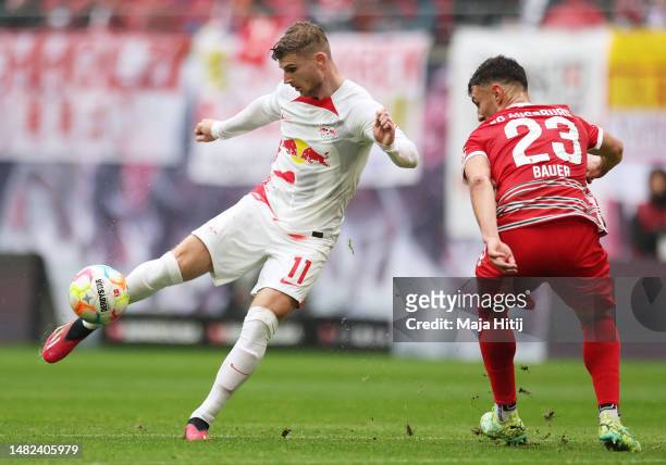 Timo Werner of RB Leipzig scores the team's third goal during the Bundesliga match between RB Leipzig and FC Augsburg at Red Bull Arena on April 15,...