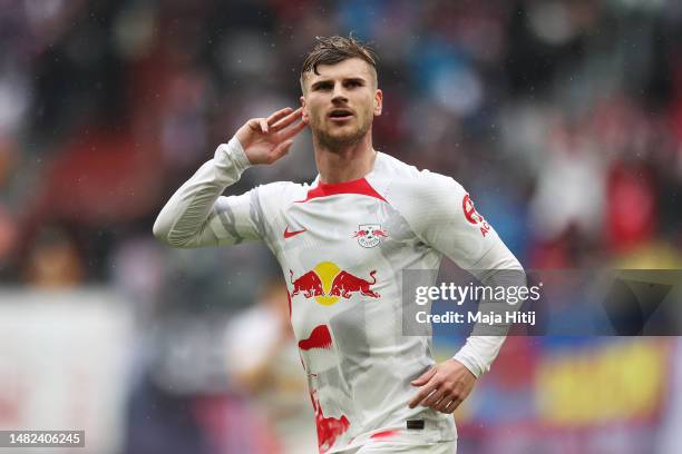 Timo Werner of RB Leipzig celebrates after scoring the team's third goal during the Bundesliga match between RB Leipzig and FC Augsburg at Red Bull...