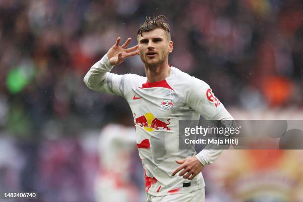 Timo Werner of RB Leipzig celebrates after scoring the team's third goal during the Bundesliga match between RB Leipzig and FC Augsburg at Red Bull...