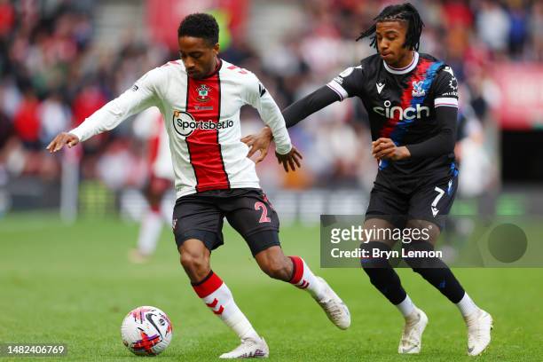 Kyle Walker-Peters of Southampton is put under pressure by Michael Olise of Crystal Palace during the Premier League match between Southampton FC and...