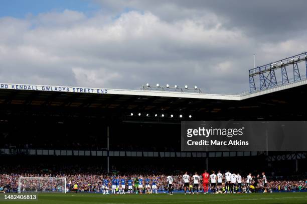 Players, officials and fans observe a minutes silence in memory of the victims of the Hillsborough disaster prior to the Premier League match between...