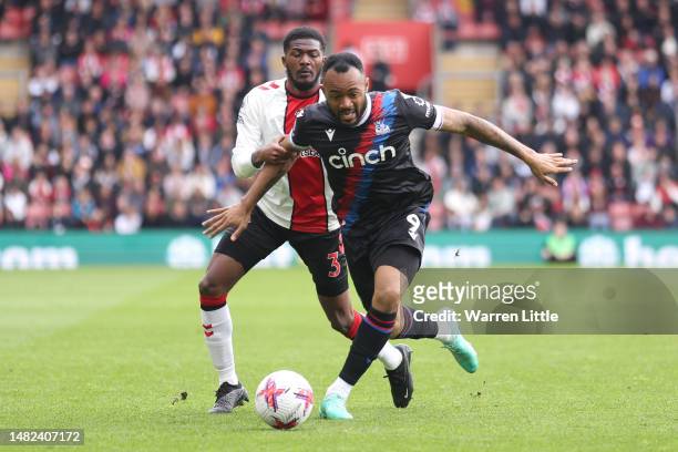 Jordan Ayew of Crystal Palace is challenged by Ainsley Maitland-Niles of Southampton during the Premier League match between Southampton FC and...