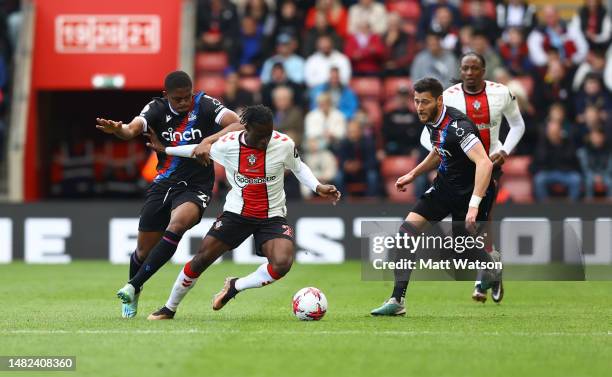 To R Cheick Doucoure of Crystal Palace, Kamaldeen Sulemana of Southampton and Joel Ward of Crystal Palace during the Premier League match between...