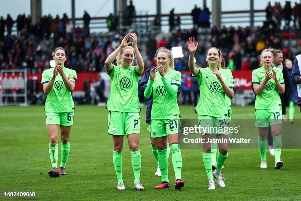 Dominique Janssen, Pauline Bremer, Rebecka Blomqvist, Joelle Wedemeyer and Kristin Demann of VfL Wolfsburg celebrate with fans after the Women's DFB...