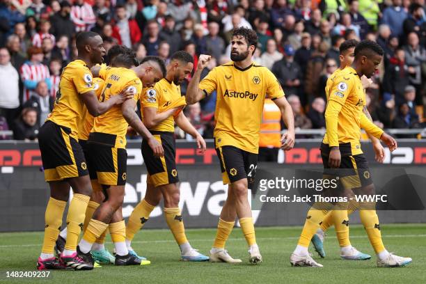 Diego Costa of Wolverhampton Wanderers celebrates alongside teammates after scoring the team's first goal during the Premier League match between...