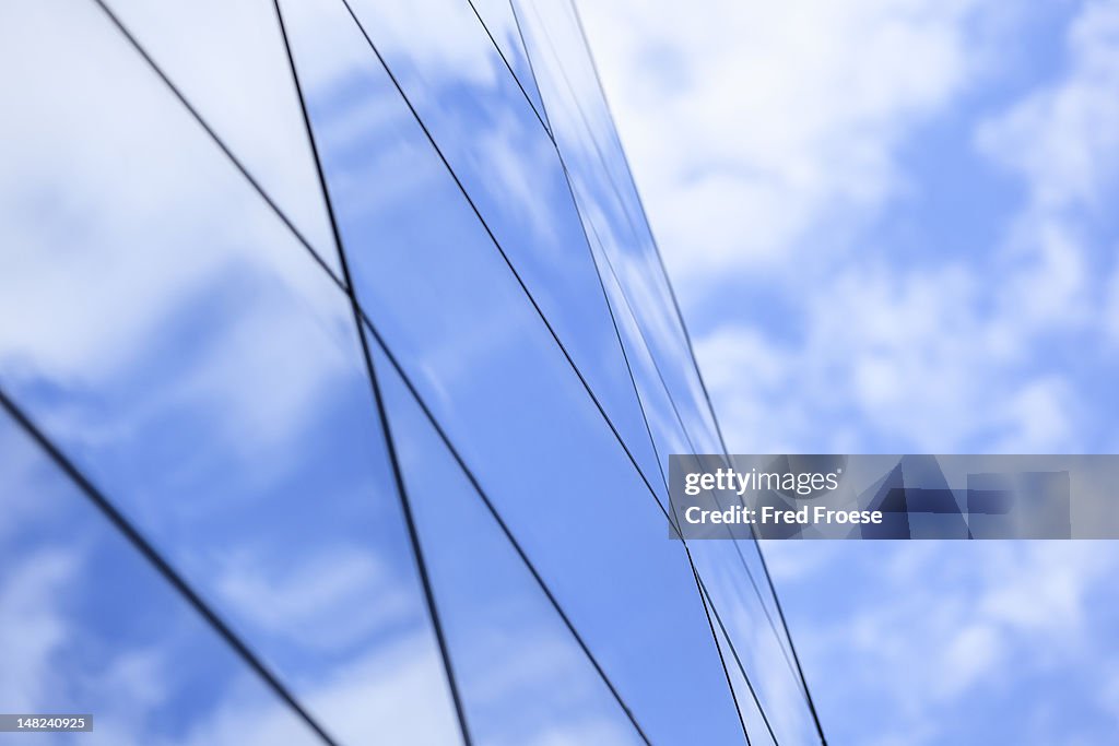 Clouds reflected in a modern glass facade