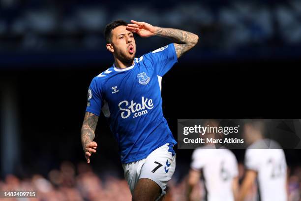 Dwight McNeil of Everton celebrates after scoring the team's first goal during the Premier League match between Everton FC and Fulham FC at Goodison...