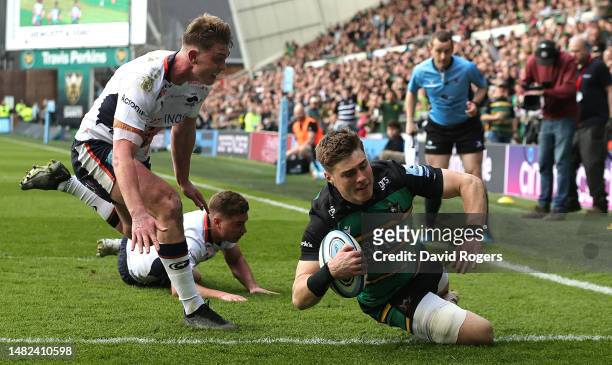 Tommy Freeman of Northampton Saints dives over for their third try during the Gallagher Premiership Rugby match between Northampton Saints and...