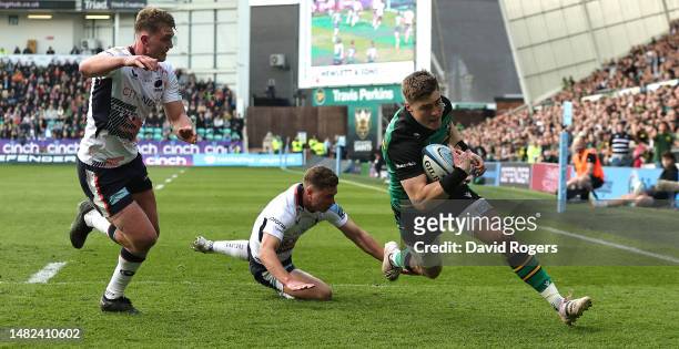 Tommy Freeman of Northampton Saints breaks clear to score their third try during the Gallagher Premiership Rugby match between Northampton Saints and...