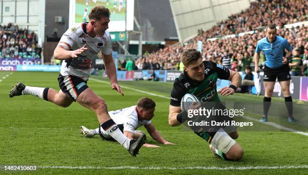 Tommy Freeman of Northampton Saints dives over for their third try during the Gallagher Premiership Rugby match between Northampton Saints and...