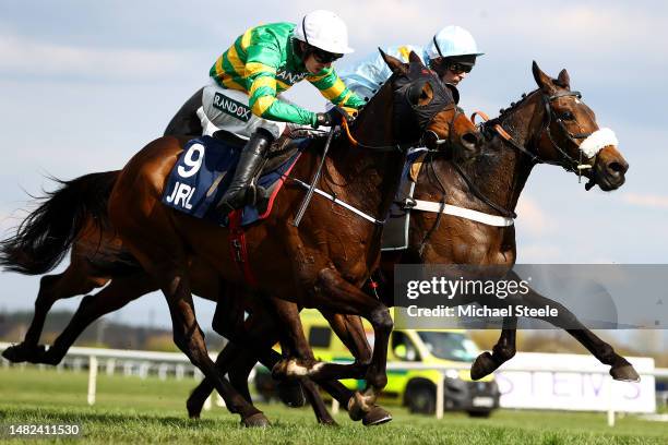 Mark Walsh riding Sire Du Berlais on the way to winning the JRL Group Liverpool Hurdle from Nico de Boinville riding Marie's Rock during Grand...